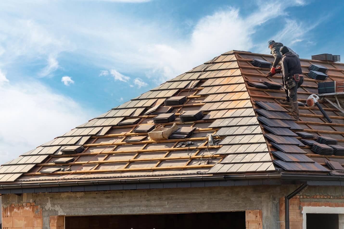 Workers installing roof panels in Utah