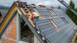 Two workers building a roof in Nibley, Utah